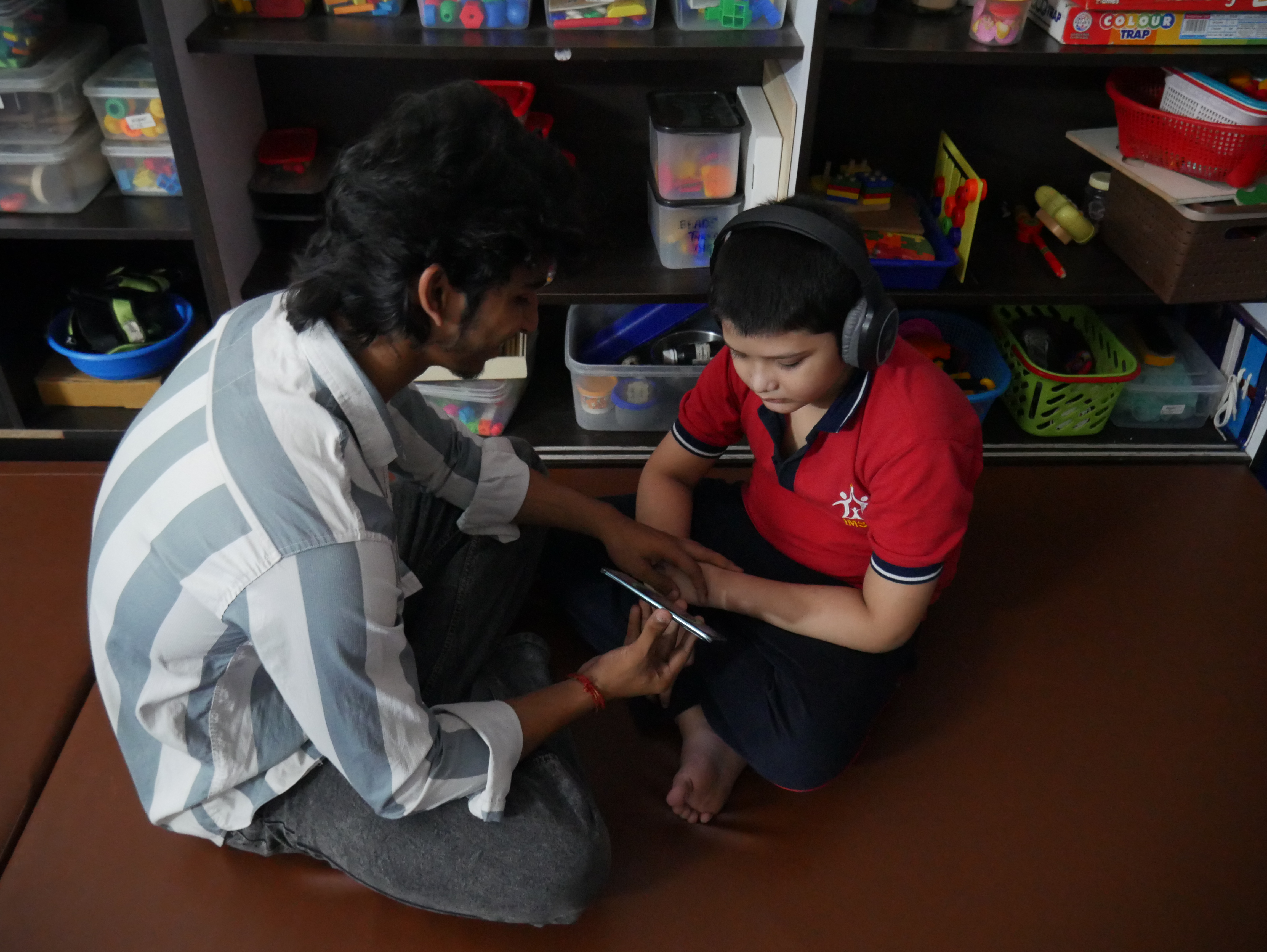Specialist guiding a child through therapy